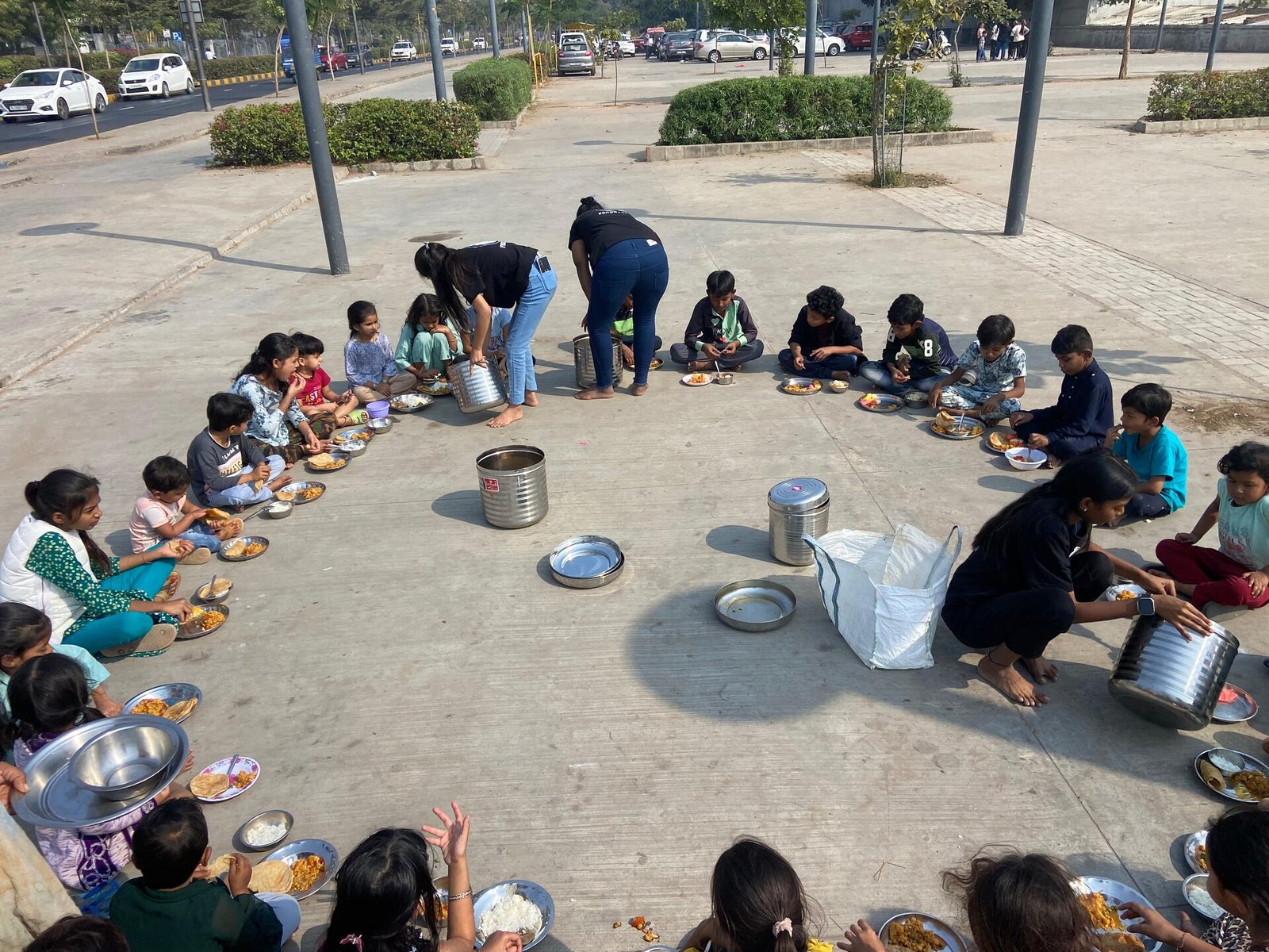 Volunteers serving meals to children in Ahmedabad